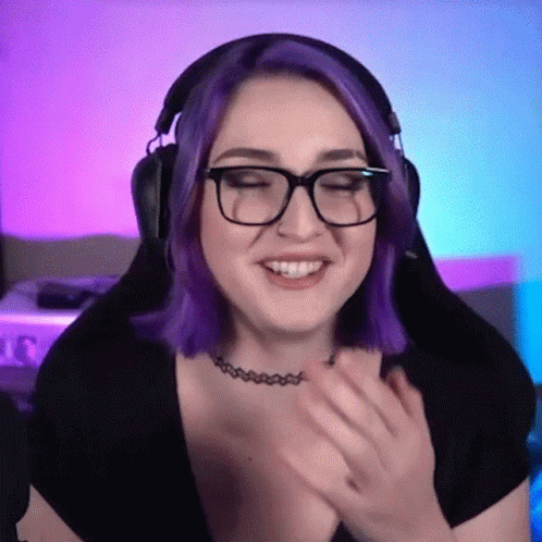 A Woman With Purple Hair Is Wearing Glasses And Headphones GIF