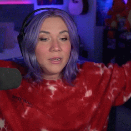 A Woman With Purple Hair Is Wearing Headphones And Says " You Are My Hero " GIF