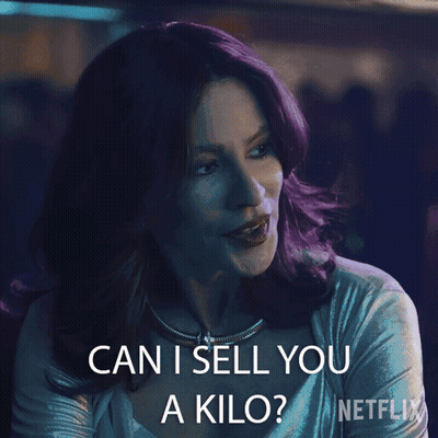 A Woman With Purple Hair Says " Can I Sell You A Kilo " In A Netflix Ad GIF