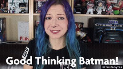 A Woman With Purple Hair Says Good Thinking Batman In Front Of A Sega Mega Drive GIF
