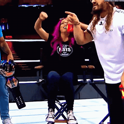A Woman With Purple Hair Wearing A Shirt That Says Fist GIF