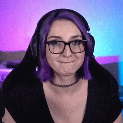 A Woman With Purple Hair Wearing Glasses And A Choker GIF
