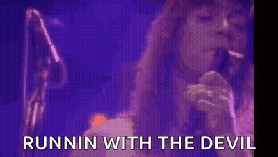 A Woman With Purple Smoke Coming Out Of Her Mouth With The Words Runnin With The Devil Written Below Her GIF