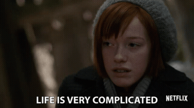 A Woman With Red Hair And A Gray Hat Says Life Is Very Complicated GIF