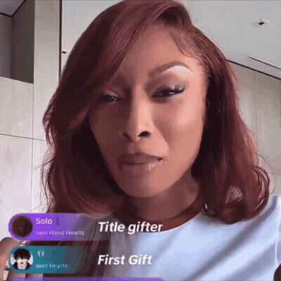 A Woman With Red Hair And A Purple Banner That Says Title Gifter GIF