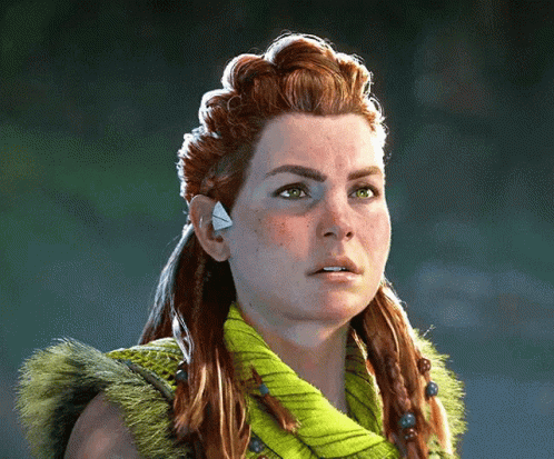 A Woman With Red Hair And Green Eyes Is Wearing A Green Sweater GIF