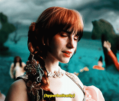 A Woman With Red Hair Has The Word Hyperbolically Written Above Her GIF
