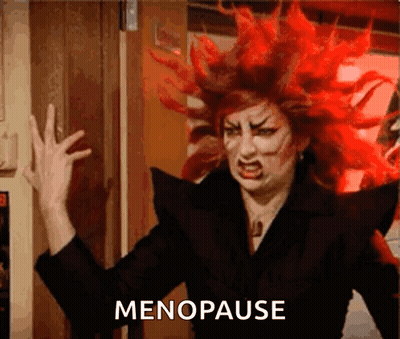 A Woman With Red Hair Has The Word Menopause Written On The Bottom GIF