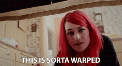 A Woman With Red Hair Has The Words This Is Sorta Warped Above Her GIF