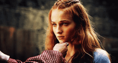 A Woman With Red Hair Is Being Touched By A Man With A Ring On Her Finger GIF