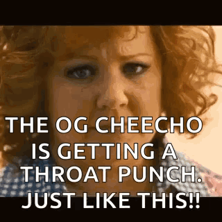 A Woman With Red Hair Is Getting A Throat Punch Just Like This . GIF