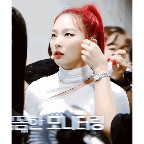 A Woman With Red Hair Is Getting Her Makeup Done By A Makeup Artist Sticker