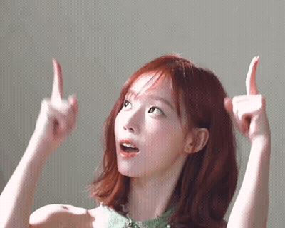 A Woman With Red Hair Is Giving The Middle Finger . GIF