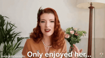 A Woman With Red Hair Is Holding A Bouquet Of Flowers And Says Only Enjoyed Her Made With Mematic GIF