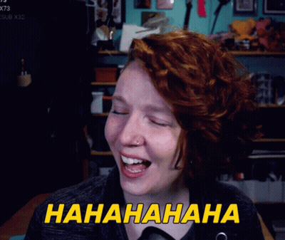A Woman With Red Hair Is Laughing With The Words Hahahaha Written In Yellow GIF