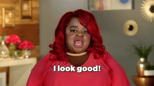 A Woman With Red Hair Is Saying `` I Look Good '' . GIF