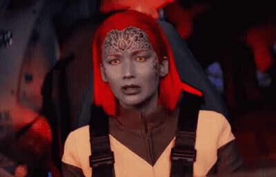 A Woman With Red Hair Is Sitting In A Car GIF