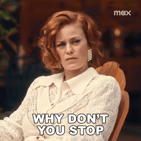 A Woman With Red Hair Is Sitting In A Chair And Says Why Don 'T You Stop . GIF