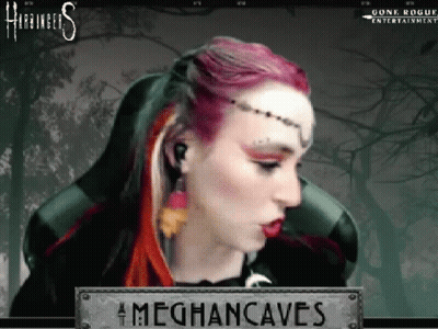 A Woman With Red Hair Is Sitting In A Chair With A Sign That Says Meghancaves On It . GIF