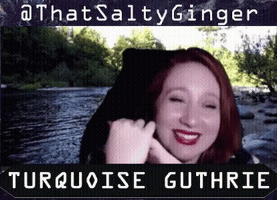 A Woman With Red Hair Is Smiling In Front Of A River With The Words Turquoise Guthrie Below Her GIF