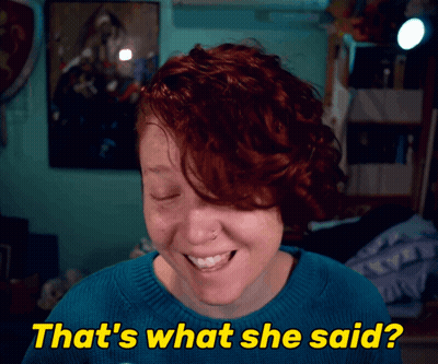 A Woman With Red Hair Is Smiling With The Words That 'S What She Said Below Her GIF