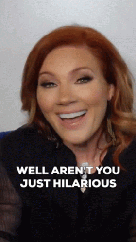A Woman With Red Hair Is Smiling With The Words Well Aren 'T You Just Hilarious Below Her GIF