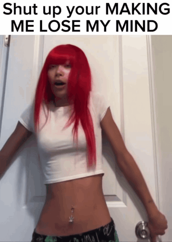 A Woman With Red Hair Is Standing In Front Of A Door With The Words Shut Up Your Making Me Lose My Mind Above Her GIF