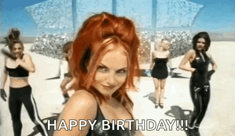A Woman With Red Hair Is Standing In Front Of A Group Of Women Dancing . GIF