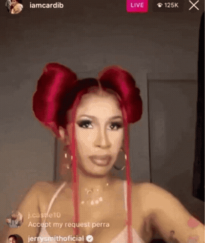 A Woman With Red Hair Is Standing In Front Of A Live Stream . GIF
