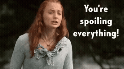 A Woman With Red Hair Is Standing In Front Of A Sign That Says " You 'Re Spoiling Everything " GIF