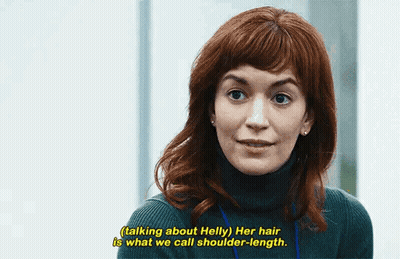 A Woman With Red Hair Is Talking About Helly Her Hair Is What We Call Shoulder - Length . GIF