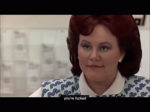 A Woman With Red Hair Is Wearing A Blue And White Vest That Says Mm On It GIF