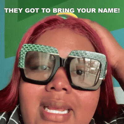 A Woman With Red Hair Is Wearing Sunglasses And Holding Her Hand To Her Head . GIF