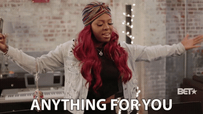 A Woman With Red Hair Says Anything For You In Front Of A Keyboard GIF