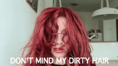 A Woman With Red Hair Says Do N't Mind My Dirty Hair . GIF