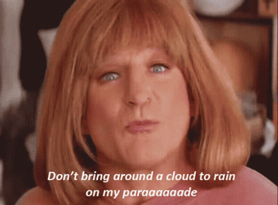 A Woman With Red Hair Says " Don T Bring Around A Cloud To Rain On My Paraaaaade " GIF
