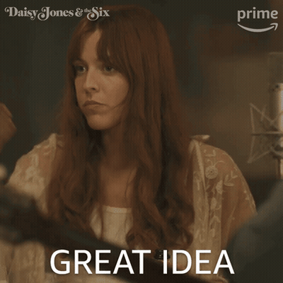 A Woman With Red Hair Says " Great Idea " In Front Of A Daisy Jones And The Six Logo GIF