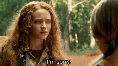 A Woman With Red Hair Says I 'M Sorry In Front Of Another Woman GIF