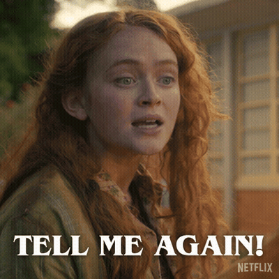 A Woman With Red Hair Says Tell Me Again On A Netflix Advertisement GIF