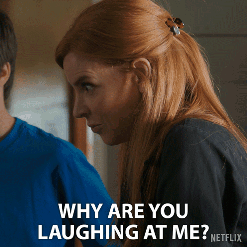 A Woman With Red Hair Says Why Are You Laughing At Me On A Netflix Ad GIF