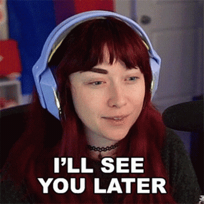 A Woman With Red Hair Wearing Headphones Says I 'Ll See You Later . GIF