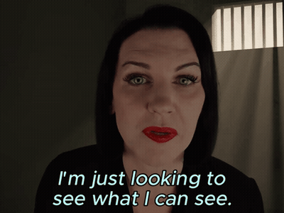 A Woman With Red Lips Is Looking To See What I Can See GIF