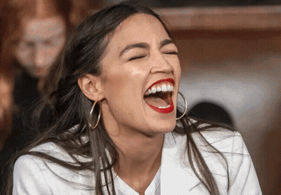 A Woman With Red Lipstick And Hoop Earrings Is Laughing With Her Eyes Closed GIF