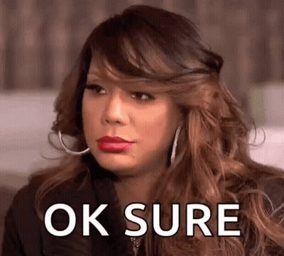 A Woman With Red Lipstick And Hoop Earrings Is Making A Funny Face And Saying Ok Sure . GIF