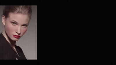 A Woman With Red Lipstick And Purple Lipstick On Her Lips Is Wearing A Black Jacket . GIF