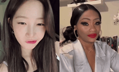 A Woman With Red Lipstick Looks At The Camera GIF