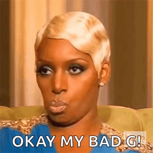 A Woman With Short Blonde Hair Is Sitting On A Couch And Says Okay My Bad G ! GIF