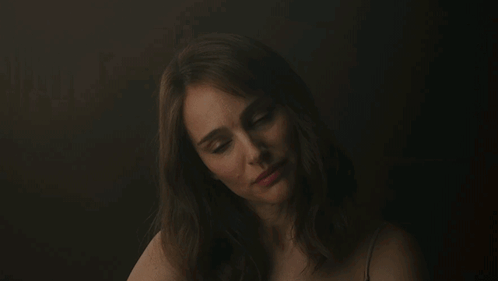 A Woman With The Name Gracie On The Bottom Of Her Face GIF