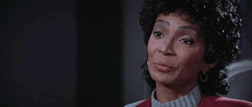 A Woman With The Words Be Careful What You Wish For Written Above Her GIF
