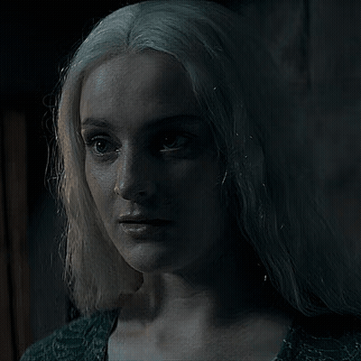 A Woman With White Hair Is Looking At The Camera GIF